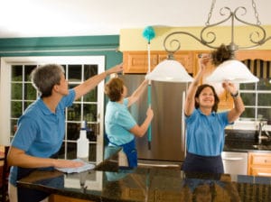 Maids cleaning a kitchen